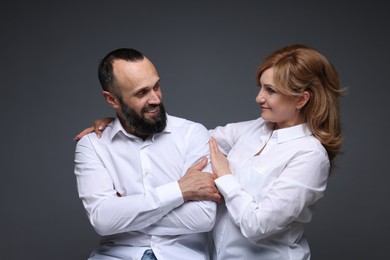 Photo of Portrait of lovely couple on grey background