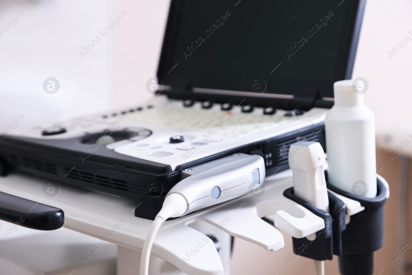 Modern ultrasound machine in clinic, closeup. Medical equipment Photo of Modern ultrasound machine in clinic, closeup. Medical equipment