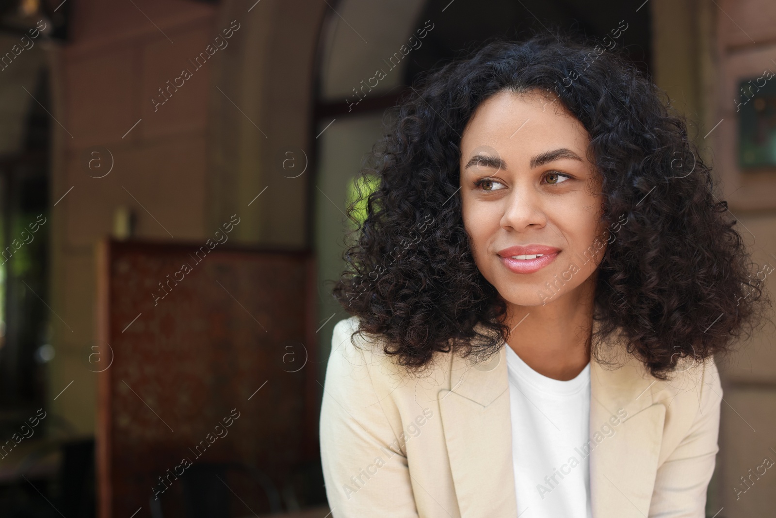 Portrait of smiling Latin American woman outdoors. Space for text Photo of Portrait of smiling Latin American woman outdoors. Space for text