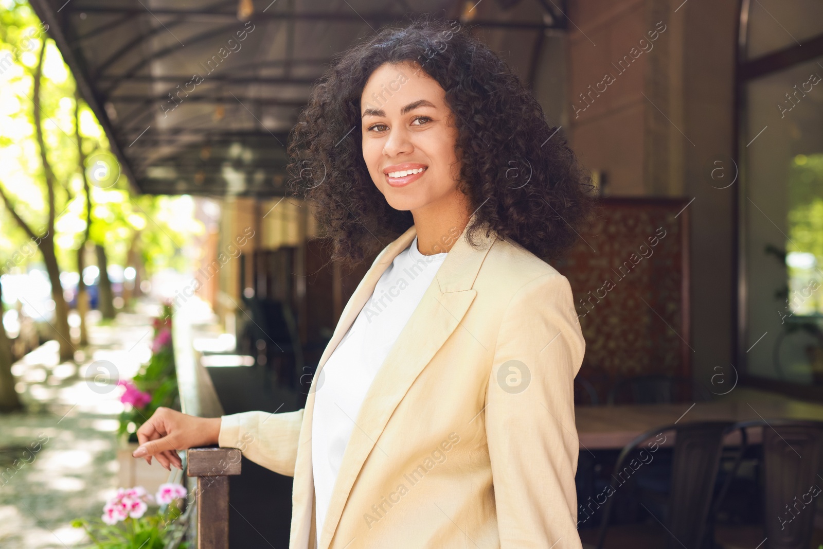 Portrait of smiling Latin American woman outdoors Photo of Portrait of smiling Latin American woman outdoors