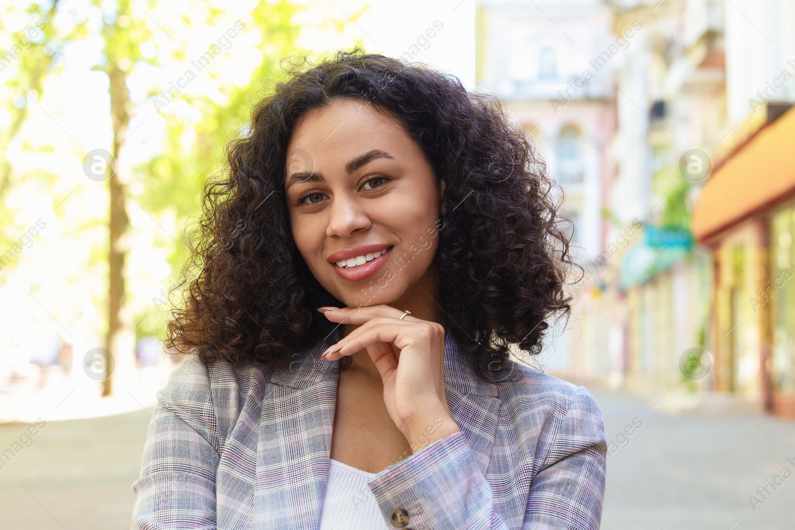 Portrait of smiling Latin American woman outdoors Photo of Portrait of smiling Latin American woman outdoors