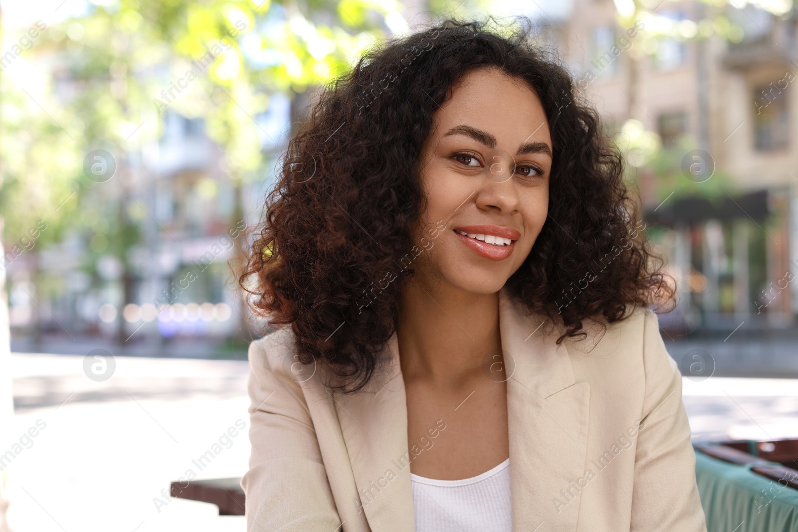 Portrait of smiling Latin American woman outdoors Photo of Portrait of smiling Latin American woman outdoors