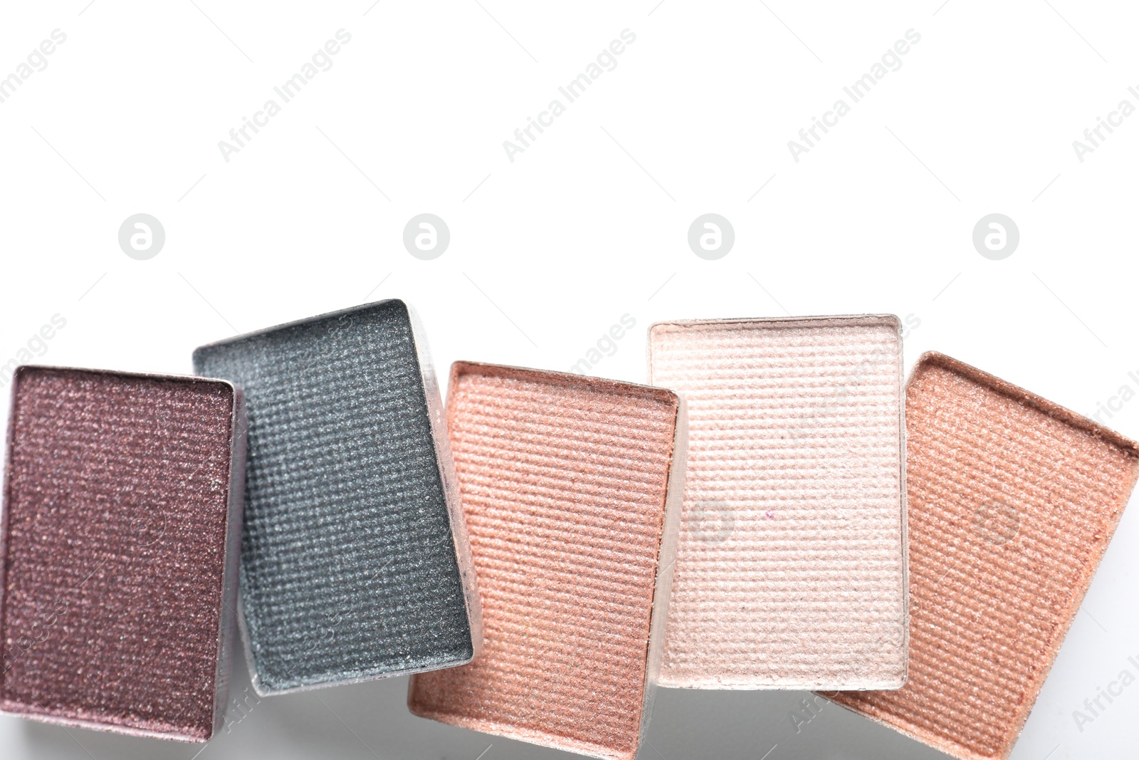 Beautiful eye shadow refill pans on white background, flat lay. Space for text Photo of Beautiful eye shadow refill pans on white background, flat lay. Space for text