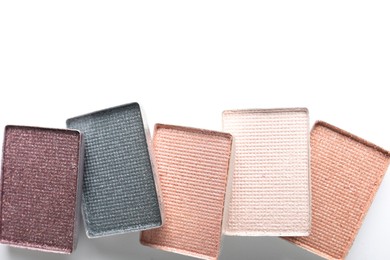 Photo of Beautiful eye shadow refill pans on white background, flat lay. Space for text