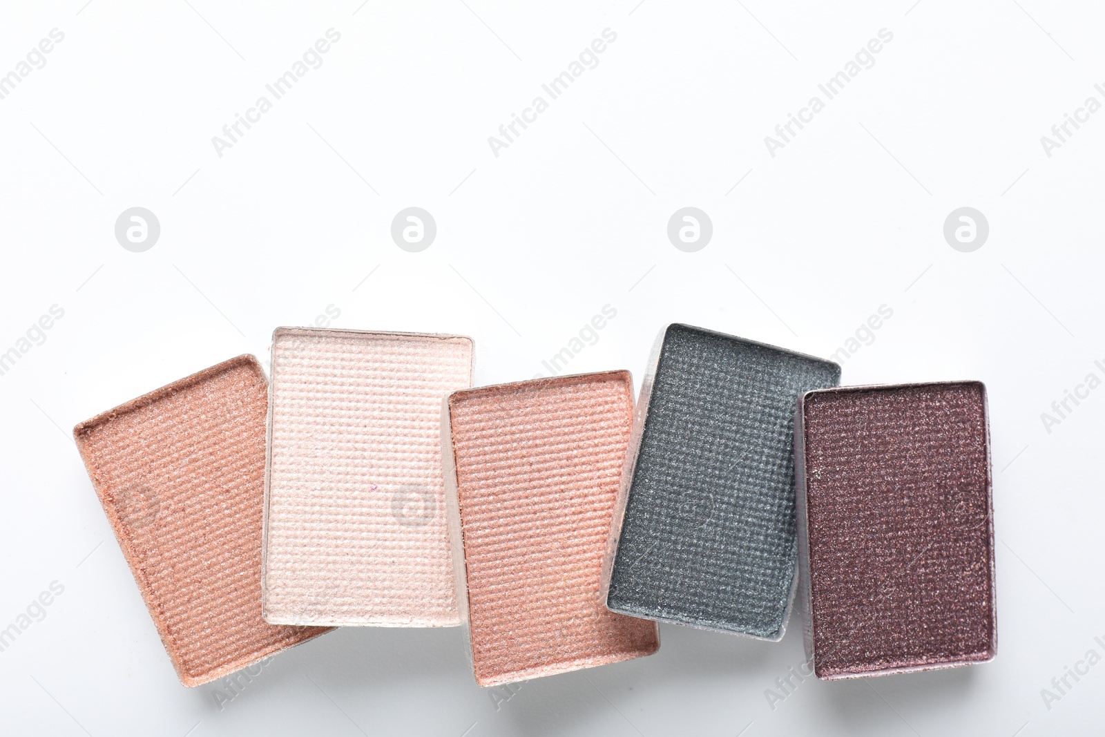 Beautiful eye shadow refill pans on white background, flat lay. Space for text Photo of Beautiful eye shadow refill pans on white background, flat lay. Space for text
