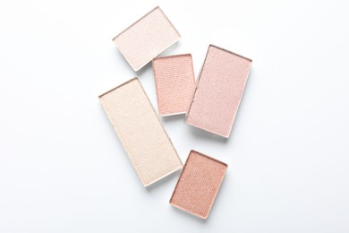 Photo of Beautiful eye shadow refill pans on white background, flat lay