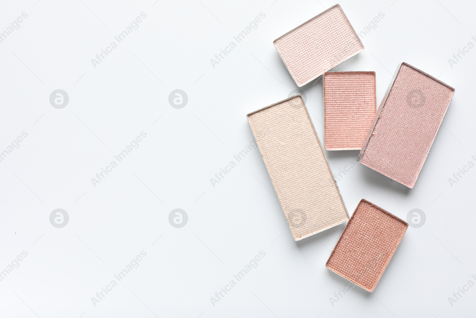 Beautiful eye shadow refill pans on white background, flat lay. Space for text Photo of Beautiful eye shadow refill pans on white background, flat lay. Space for text