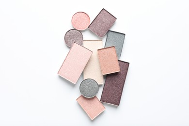 Photo of Beautiful eye shadow refill pans on white background, flat lay