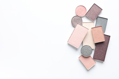 Photo of Beautiful eye shadow refill pans on white background, flat lay. Space for text