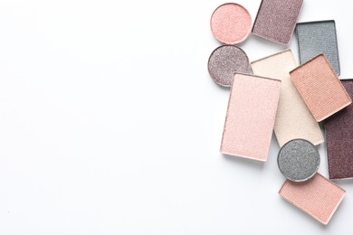 Photo of Beautiful eye shadow refill pans on white background, flat lay. Space for text