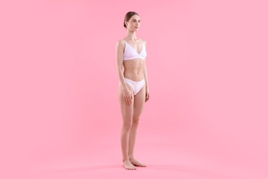 Photo of Woman wearing beautiful underwear on pink background