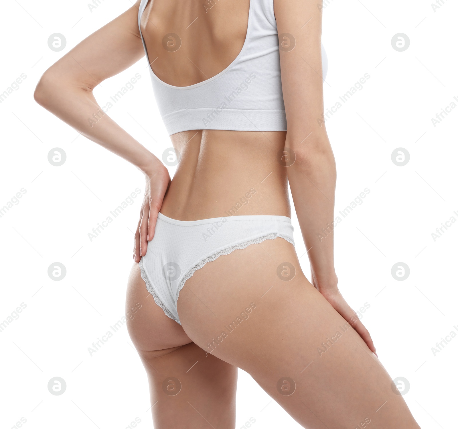 Woman wearing beautiful underwear on white background, closeup Photo of Woman wearing beautiful underwear on white background, closeup