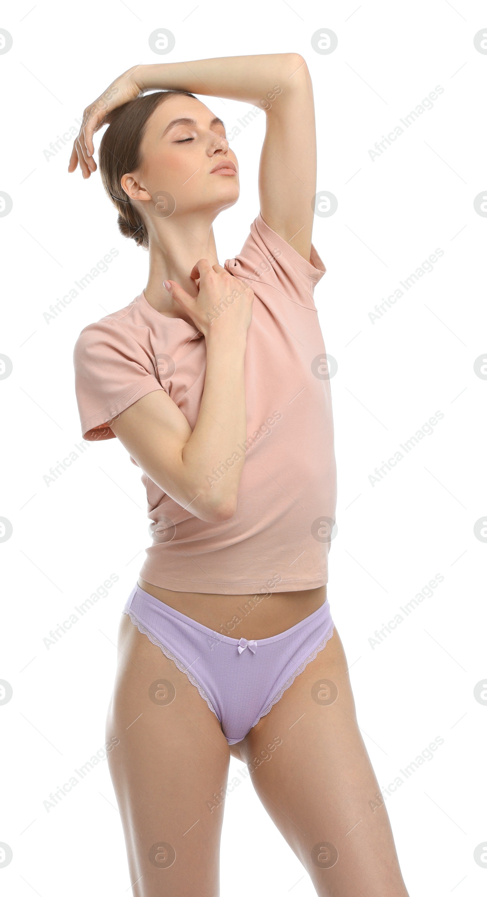 Woman wearing beautiful underwear on white background Photo of Woman wearing beautiful underwear on white background