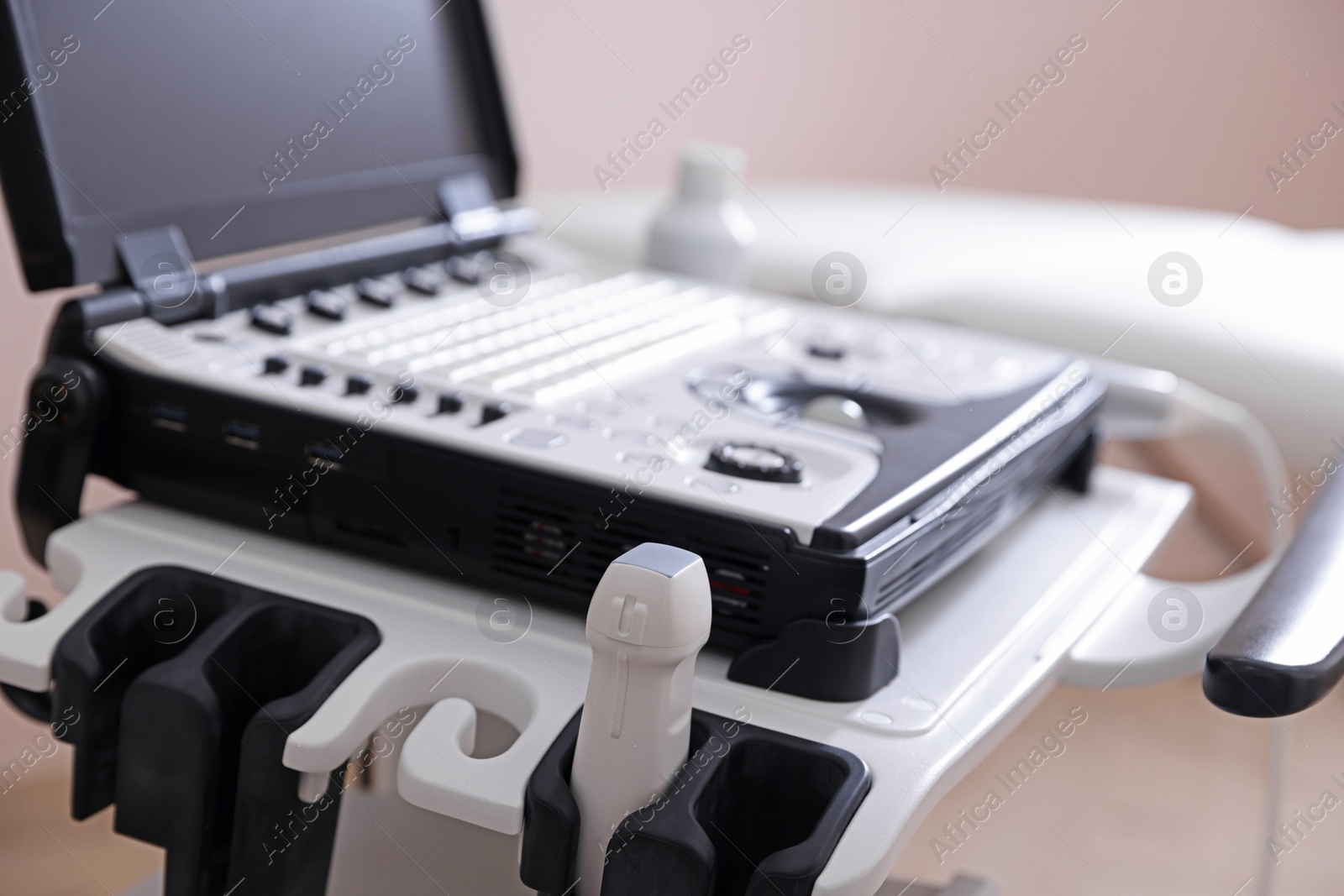 Modern ultrasound machine in clinic, closeup. Medical equipment Photo of Modern ultrasound machine in clinic, closeup. Medical equipment