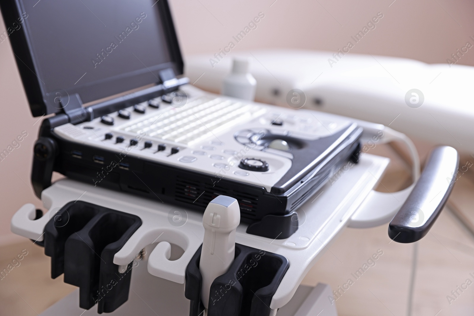 Modern ultrasound machine in clinic, closeup. Medical equipment Photo of Modern ultrasound machine in clinic, closeup. Medical equipment