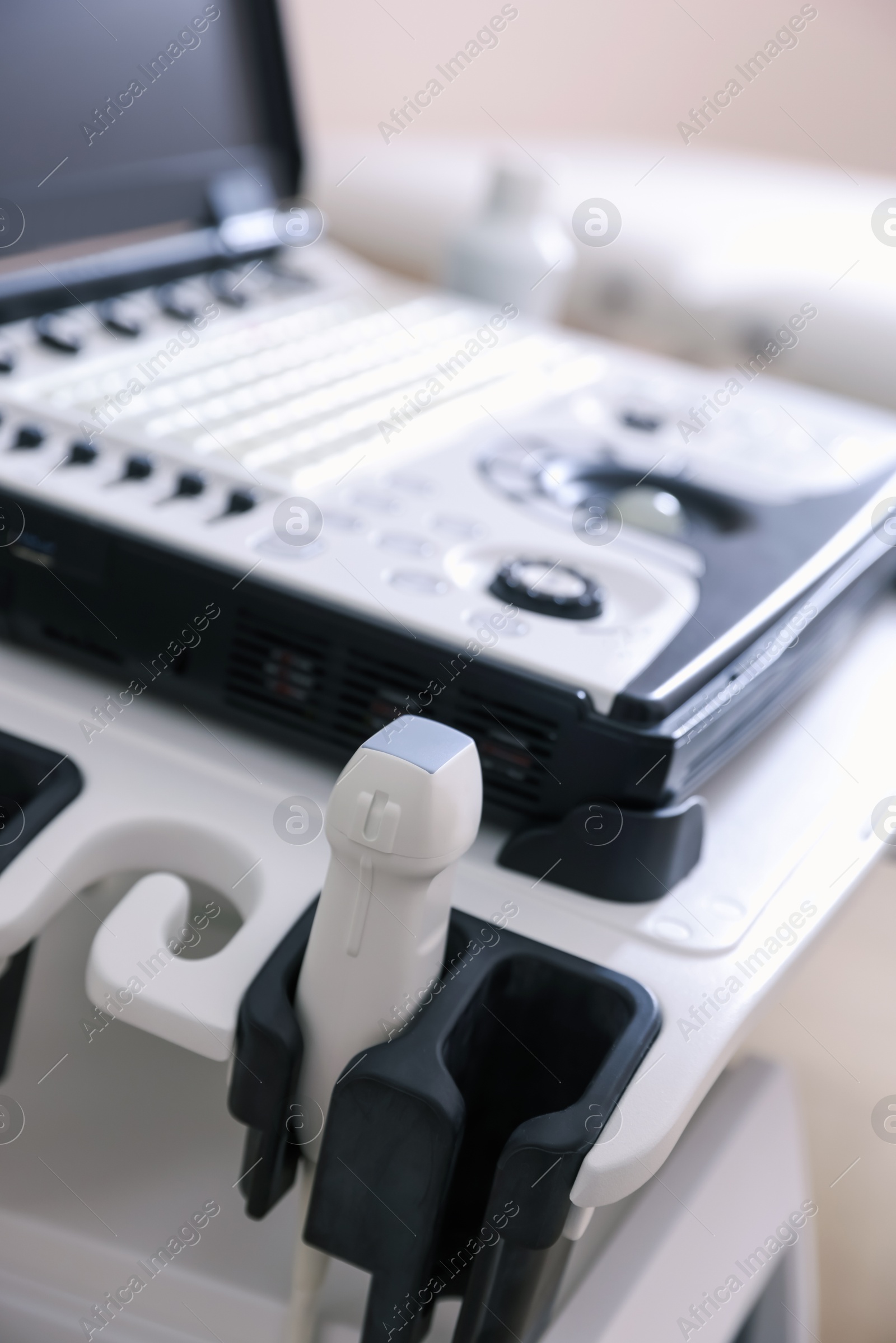Modern ultrasound machine in clinic, closeup. Medical equipment Photo of Modern ultrasound machine in clinic, closeup. Medical equipment
