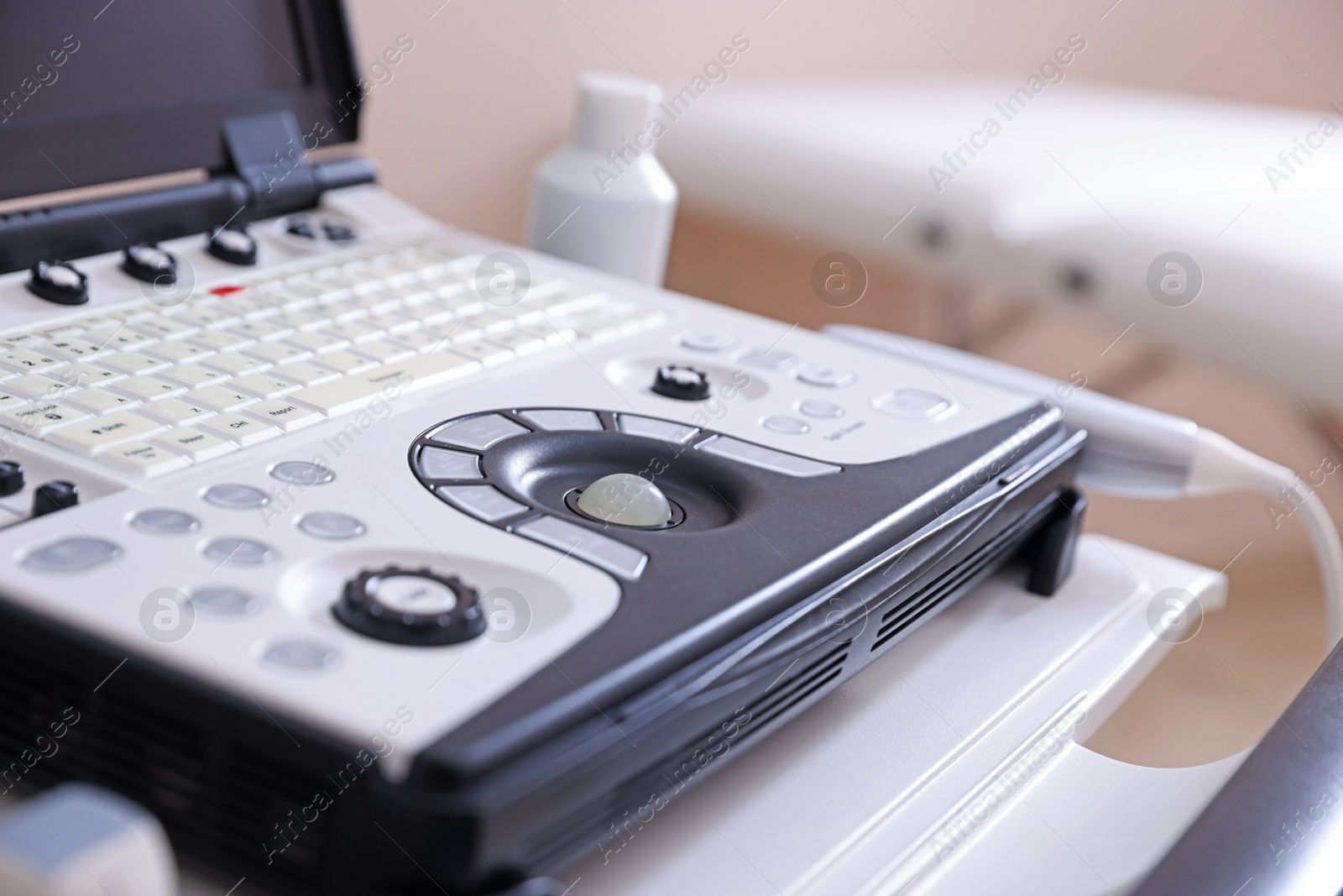 Modern ultrasound machine in clinic, closeup. Medical equipment Photo of Modern ultrasound machine in clinic, closeup. Medical equipment
