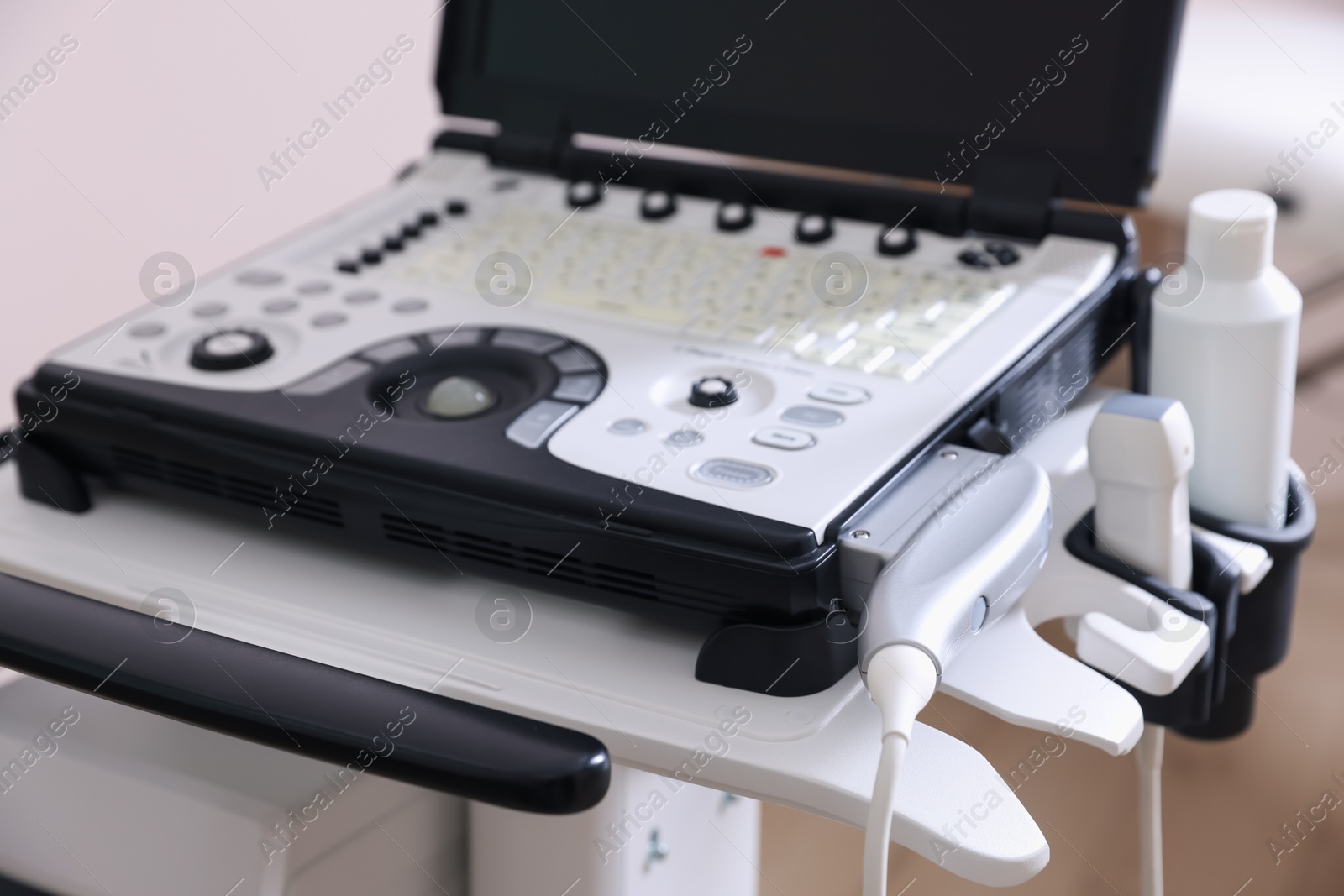 Modern ultrasound machine in clinic, closeup. Medical equipment Photo of Modern ultrasound machine in clinic, closeup. Medical equipment