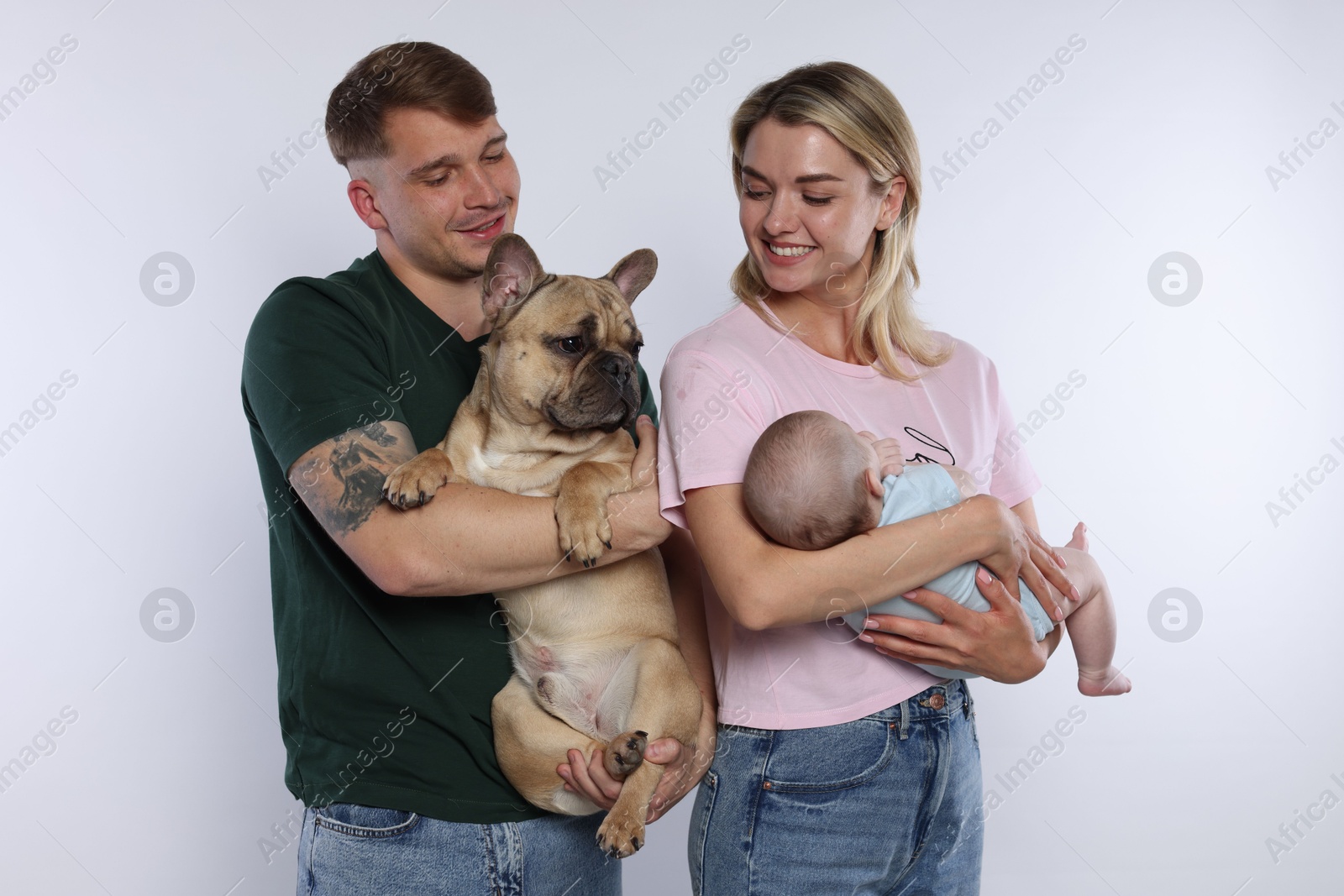 Happy family with little baby and cute dog on white background Photo of Happy family with little baby and cute dog on white background
