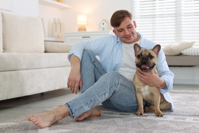 Photo of Man and his cute dog at home