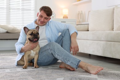Photo of Man and his cute dog at home