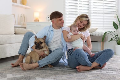 Photo of Happy family with little baby and cute dog at home