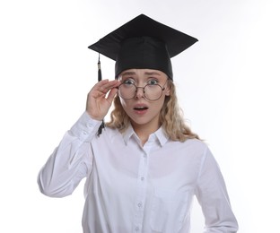 Photo of Emotional student after graduation on white background