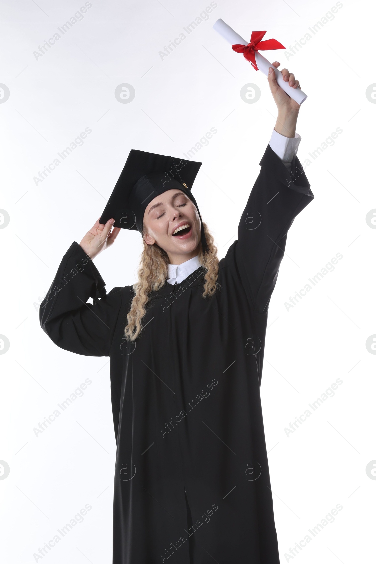 Happy student with diploma after graduation on white background Photo of Happy student with diploma after graduation on white background