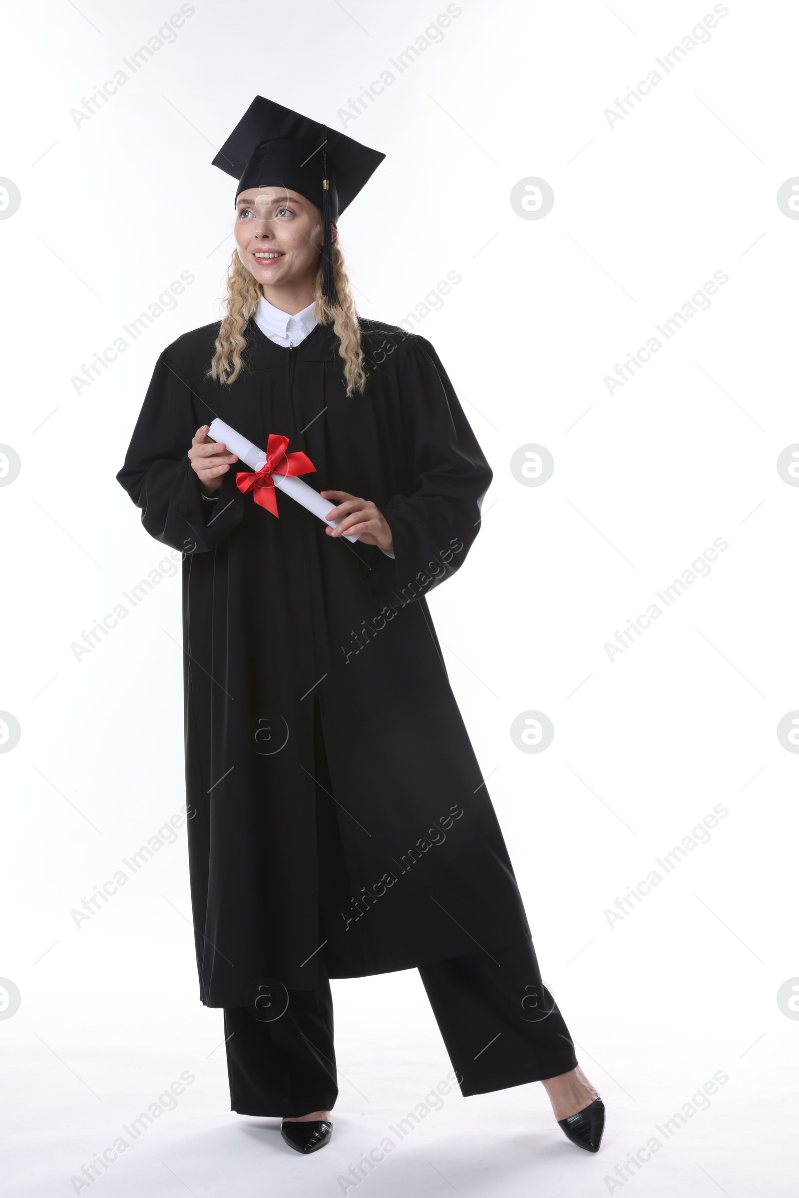 Happy student with diploma after graduation on white background Photo of Happy student with diploma after graduation on white background
