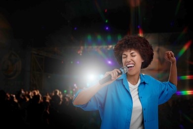 Image of Beautiful woman singing at open air festival