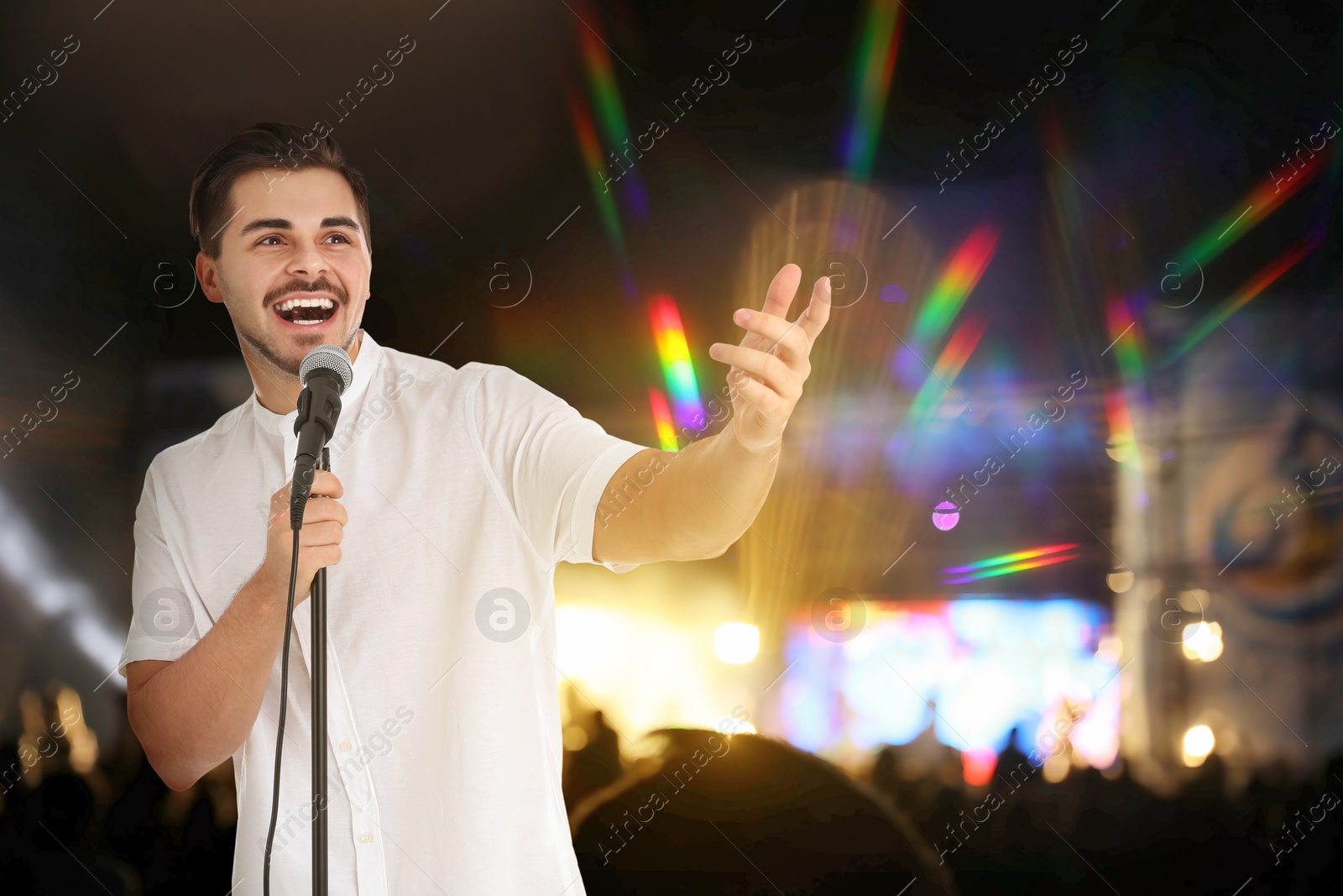Young handsome man singing at open air festival Image of Young handsome man singing at open air festival