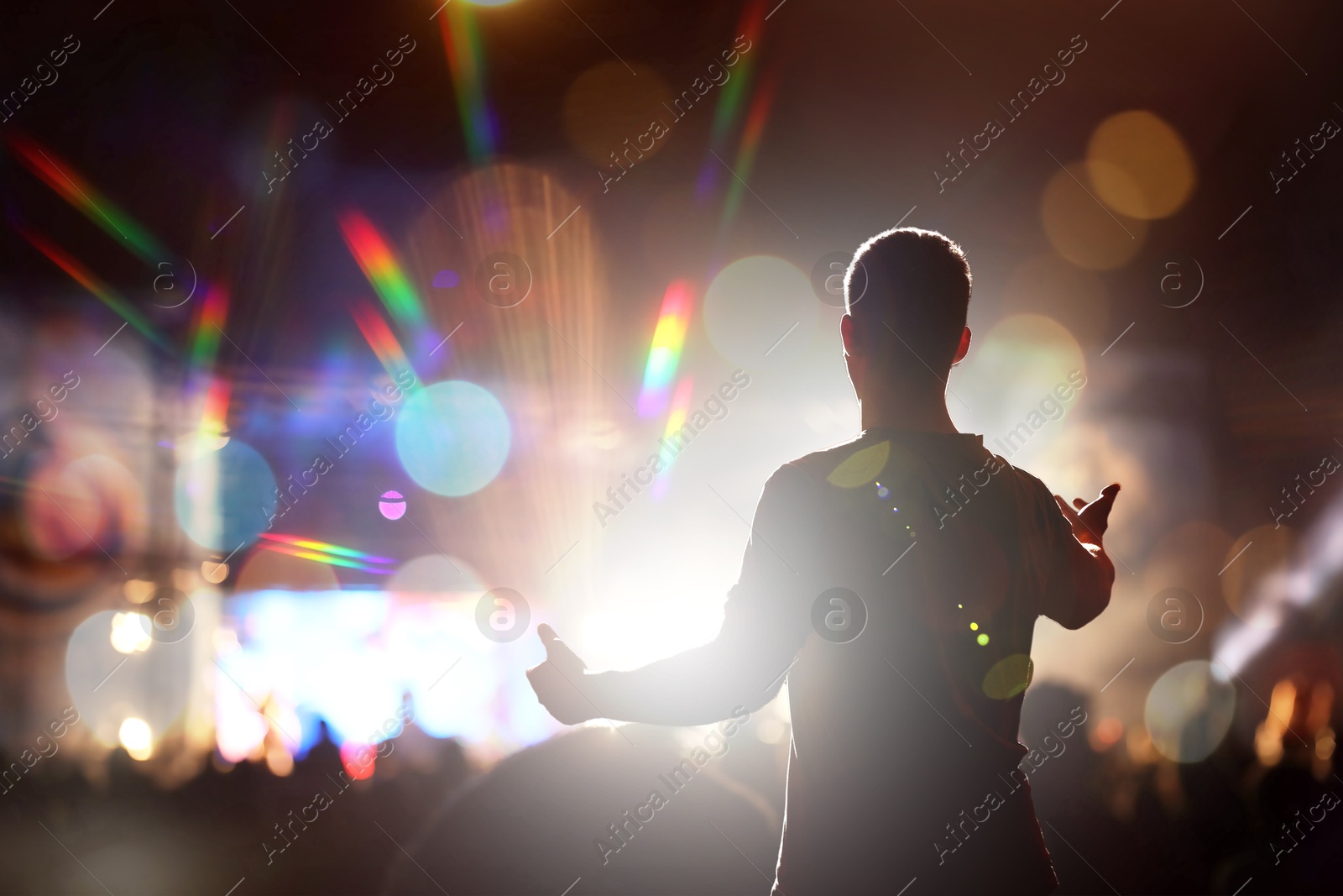 Man performing on stage of open air festival Image of Man performing on stage of open air festival