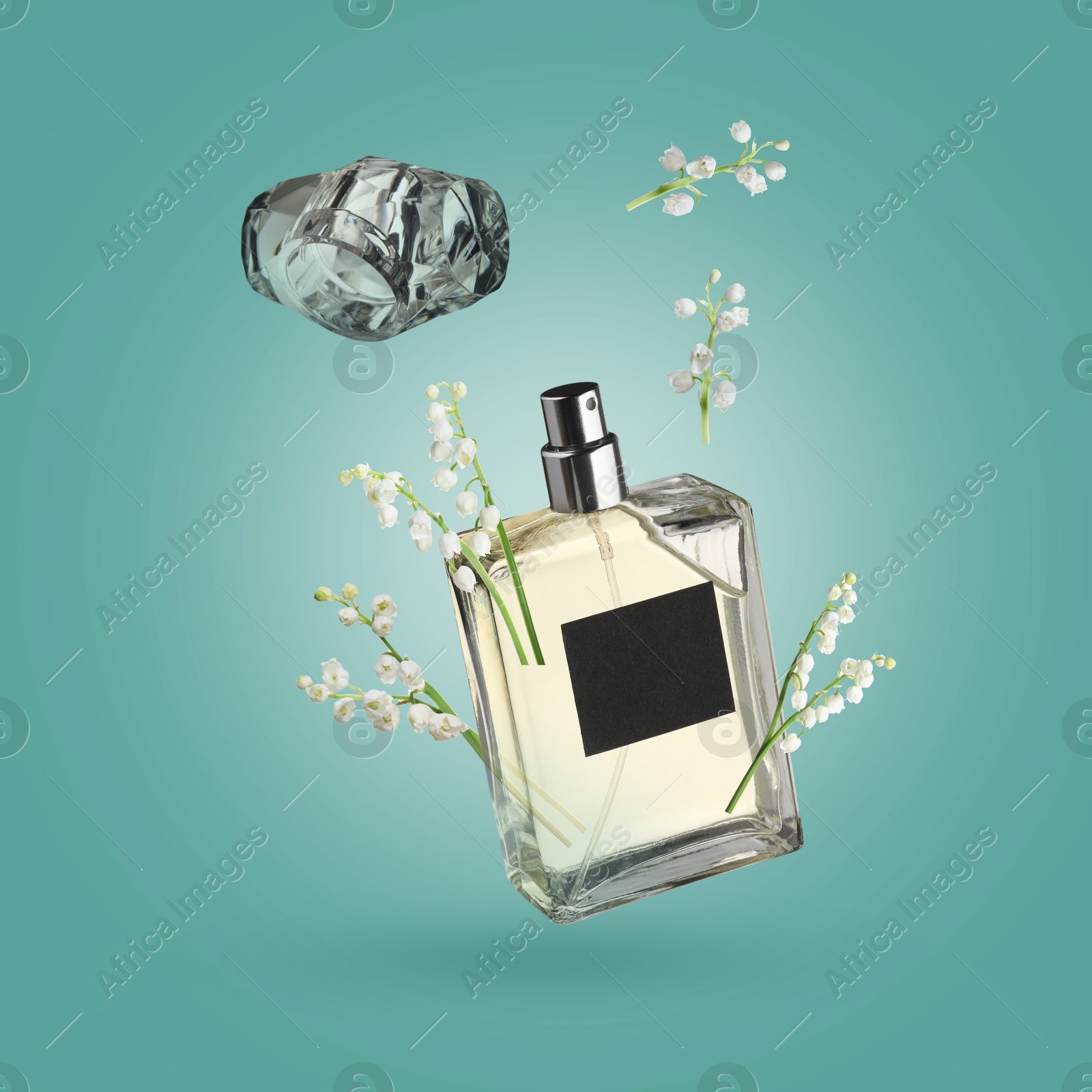 Lilies of the valley and bottle of perfume in air on turquoise background Image of Lilies of the valley and bottle of perfume in air on turquoise background