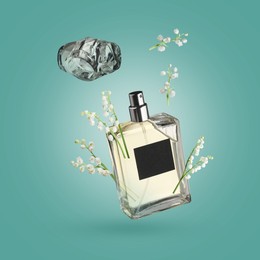 Image of Lilies of the valley and bottle of perfume in air on turquoise background