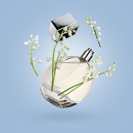 Image of Lilies of the valley and bottle of perfume in air on light blue background