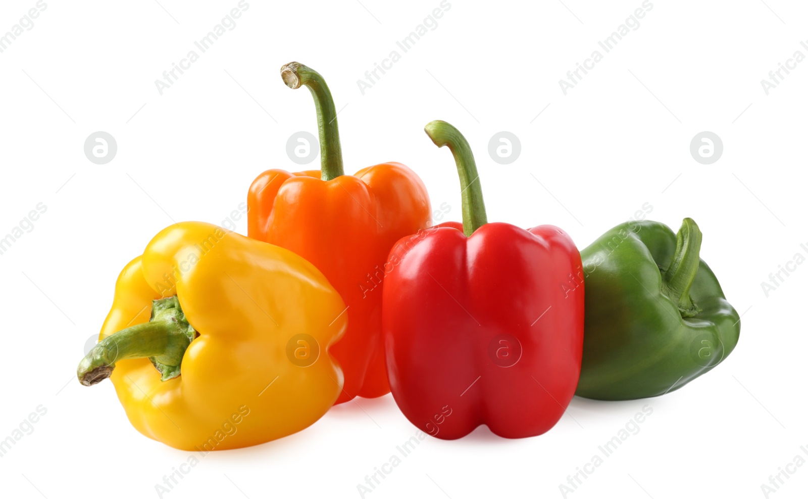 Ripe colorful bell peppers isolated on white Photo of Ripe colorful bell peppers isolated on white