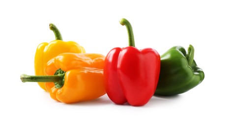 Photo of Ripe colorful bell peppers isolated on white