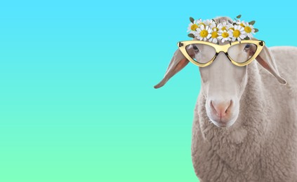 Image of Adorable sheep with sunglasses and flower wreath against turquoise gradient background. Banner design with space for text