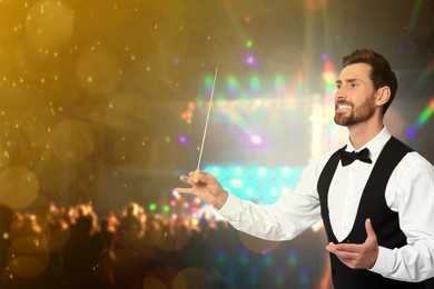 Image of Conductor with baton at open air festival