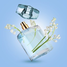 Image of Lilies of the valley and bottle of perfume in air on light blue background