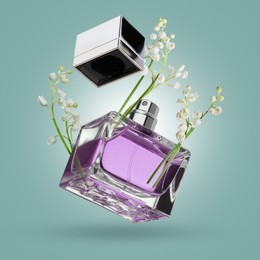 Image of Lilies of the valley and bottle of perfume in air on pale turquoise background