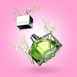 Image of Lilies of the valley and bottle of perfume in air on violet background