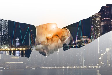 Image of Businessmen shaking hands, double exposure with cityscape and workers. Successful partnership and startup