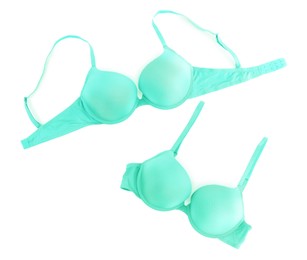 Image of Beautiful turquoise bra isolated on white, collage. Top view