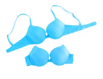 Image of Beautiful light blue bra isolated on white, collage. Top view