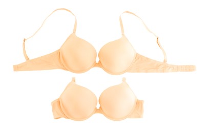 Image of Beautiful beige bra isolated on white, collage. Top view