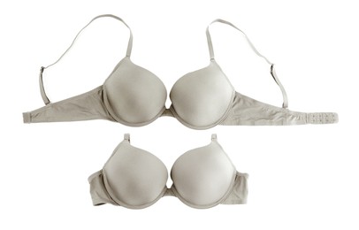 Image of Beautiful grey bra isolated on white, collage. Top view