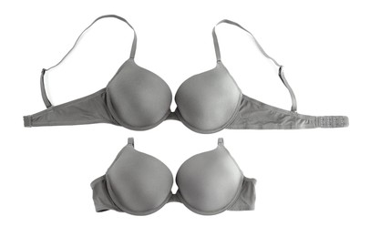 Image of Beautiful grey bra isolated on white, collage. Top view