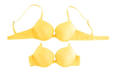 Image of Beautiful yellow bra isolated on white, collage. Top view