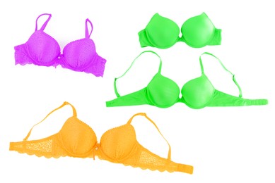 Image of Bras of different colors isolated on white, collage. Top view